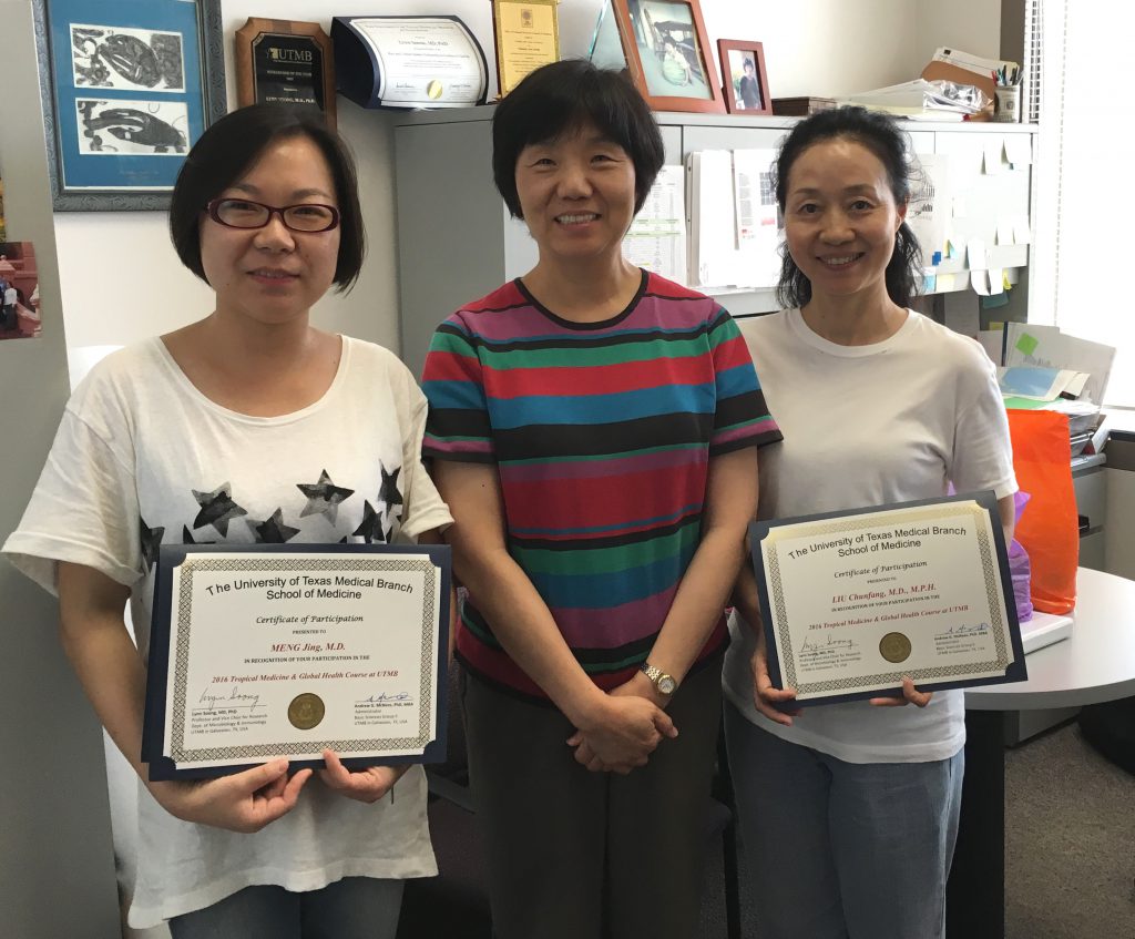 Angeline (left) and Kathleen (right) show off their certificates from UTMB with Professor Lynn Soong.