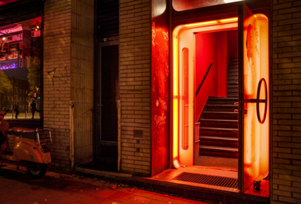 Open door with red light. Photo by Mali Maeder.