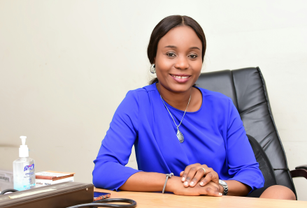 Yetunde sitting at a desk.