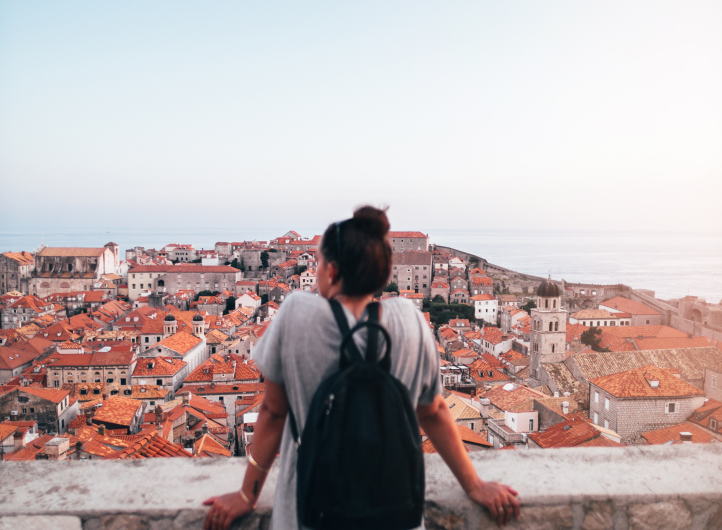 Woman looking out at city